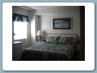 Queen Bedroom with full bathtub/shower. Has flat screen TV, and DVD player